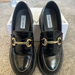 Steve Madden Glossy Black Loafers with Gold Buckle